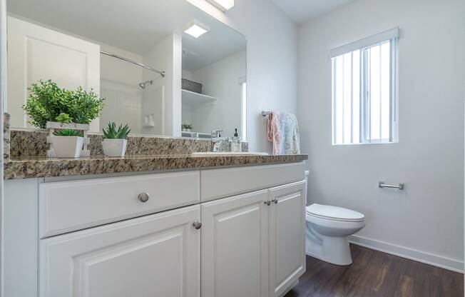 Renovated Bathrooms With Quartz Counters at Park Apartments, California, 90650