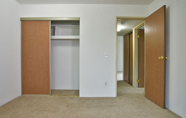 Master Bedroom with Large Closet at Charter Oaks Apartments, Davison, Michigan