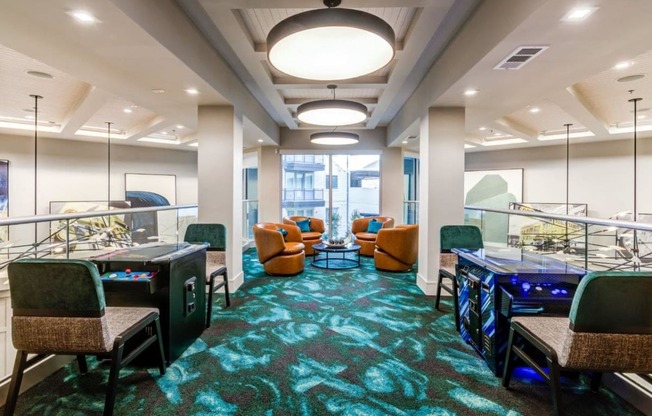 a conference room with tables and chairs and videogames