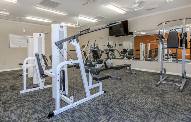 Gym with commercial exercise equipment at Ashley Oaks Apartments in Greensboro, North Carolina