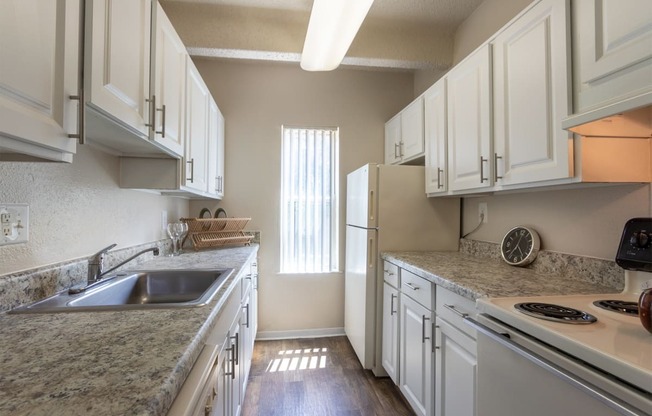 This is a photo of the kitchen in the 965 square foot 2 bedroom, 2 bath  apartment at Harvard Square Apartments, in Dallas, TX.