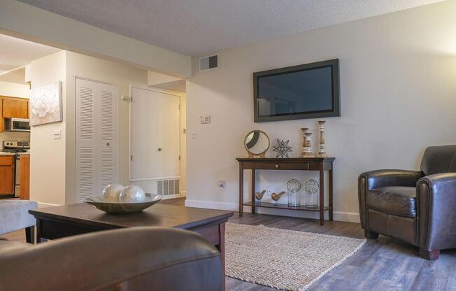 a living room filled with furniture and a tv