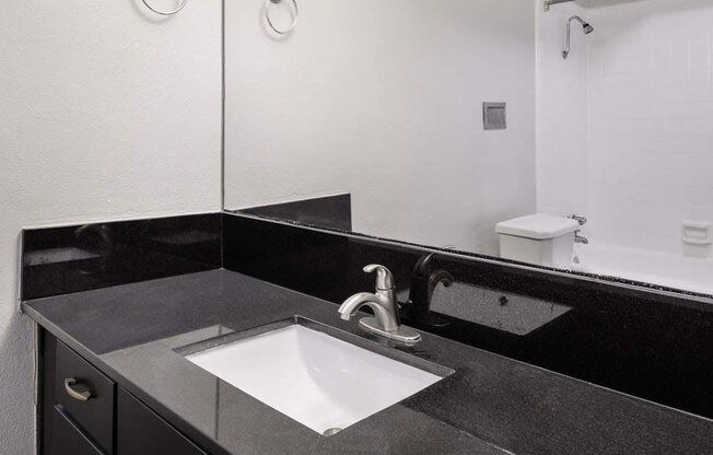 Renovated Bathrooms With Quartz Counters at Memorial Towers Apartments, The Barvin Group, Houston, TX