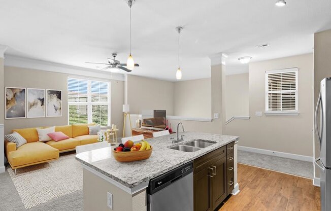 a kitchen and living room with a counter top