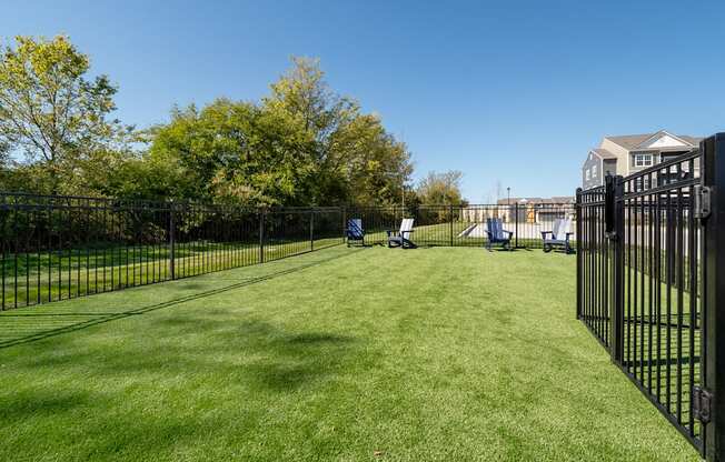 dog park with fence and chairs  at Aventura at Hawk Ridge, Lake St Louis, MO, 63367