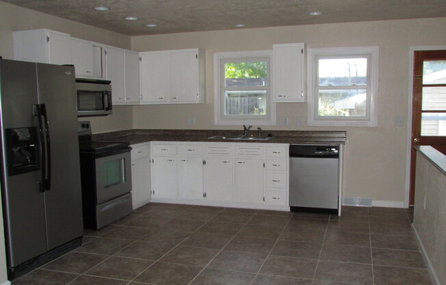 3 BEDROOM | 2 BATH | DOUBLE CAR GARAGE | WEST SIDE HOME