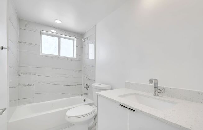 Brand New 2023 Renovated Building! 1 Bd/1 Ba, quartz countertops, washer/dryer, stainless steel appliances, 1 parking space.