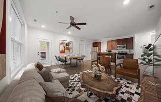 A living room with a brown couch and a coffee table at River Mill Lofts & Skyloft in Asheville, 28803