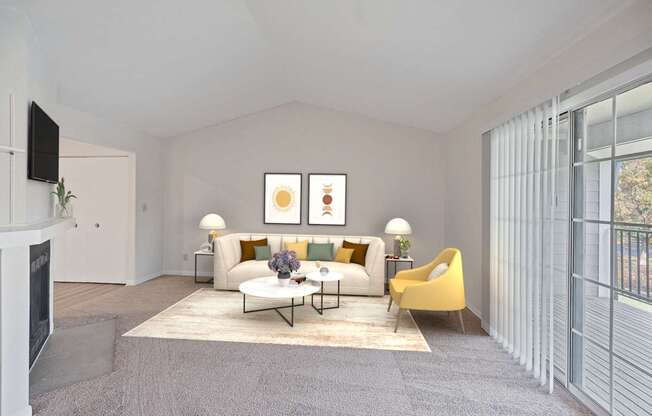 a living room with a white couch and a yellow chair