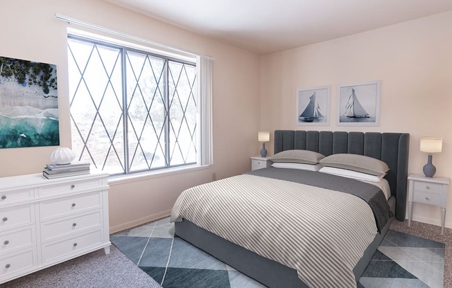 bedroom with large window at fox hill glen apartments