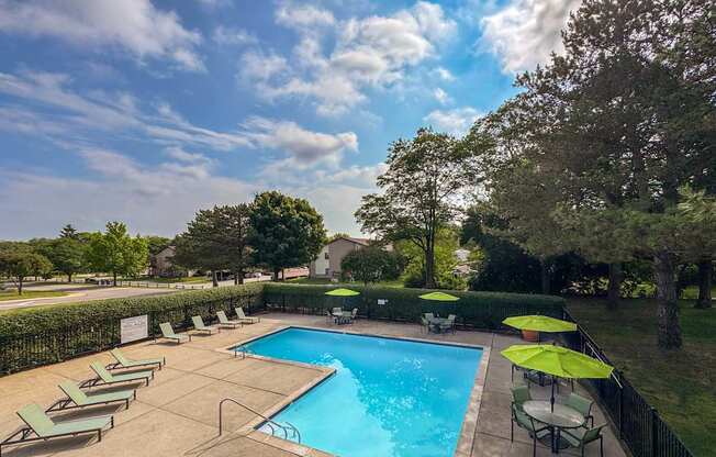 Pool with sundeck at Woodland Villa Apartments in Westland, MI.