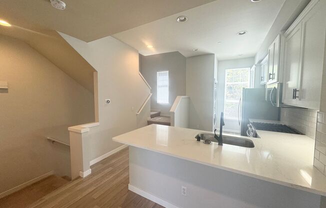 Spacious is Aqua Highlands one bedroom plus den townhome with garage