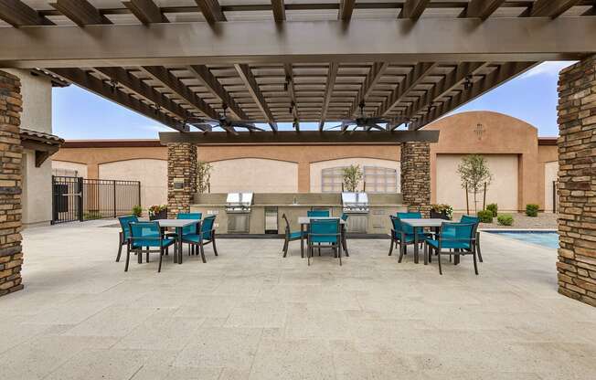 Outdoor BBQ Grill with Intimate Seating Area at Pillar Lago