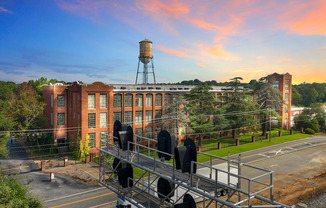 an aerial view of a building with a water tower