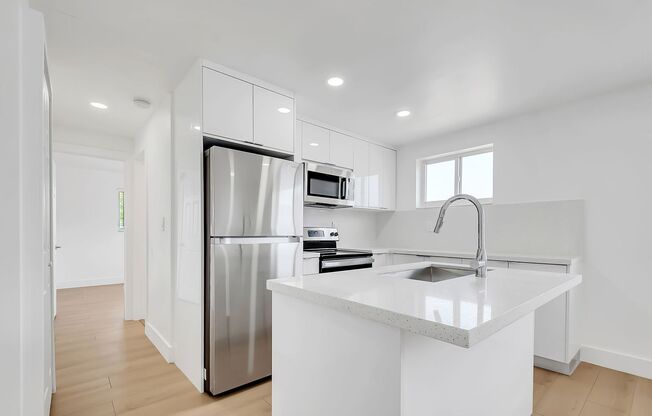 Brand New 2023 Renovated Building! 1 Bd/1 Ba, quartz countertops, washer/dryer, stainless steel appliances, 1 parking space.