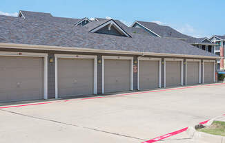 a row of garage doors on the side of a building