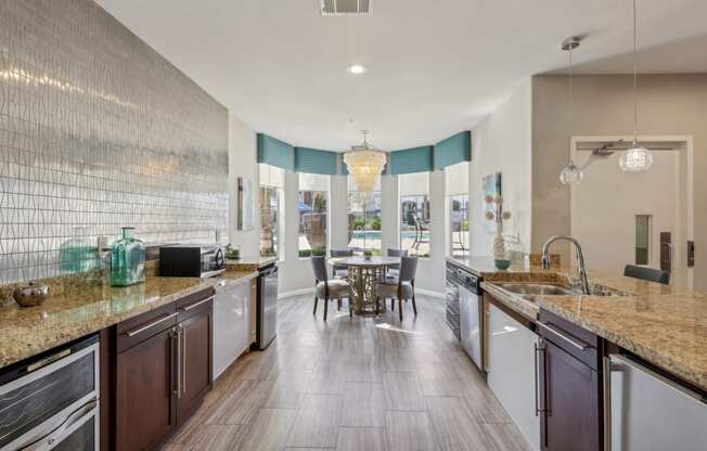 a kitchen with granite counter tops and a dining room with a table
