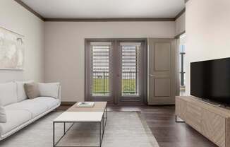 A living room with a white couch, a coffee table, and a television.