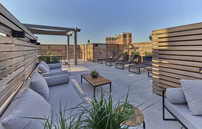 Comfortable outdoor lounge at The Mint Rahway with modern seating and city views, near Rahway Train Station and Union County Performing Arts Center.