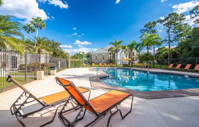 Outdoor pool with lounge seating from a different angle