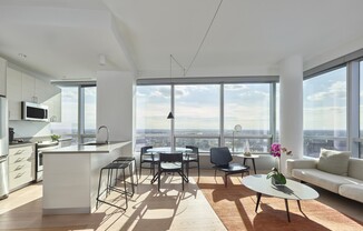 A modern kitchen with a view of the city.