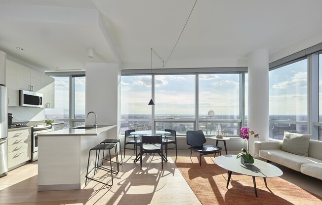 A modern kitchen with a view of the city.