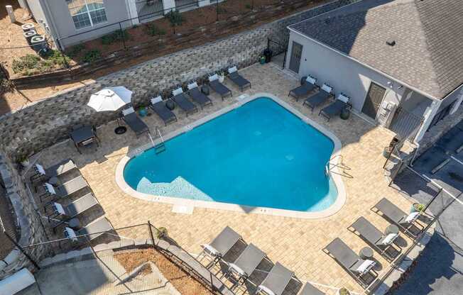 a view of the pool from the roof of a hotel