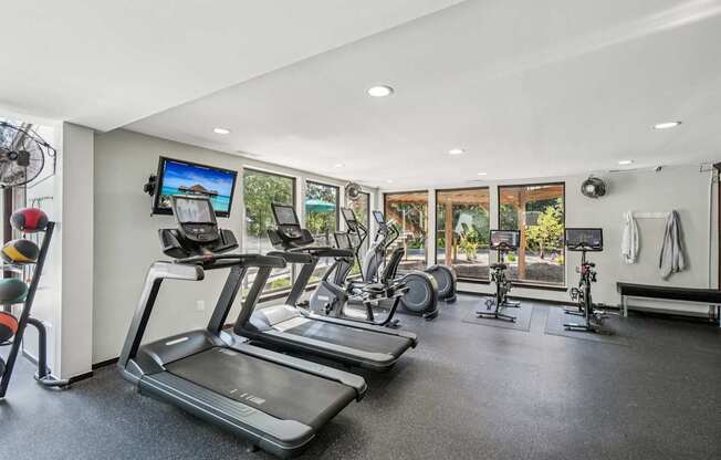 A spacious 24/7 fitness center with Peloton and LifeFitness equipment