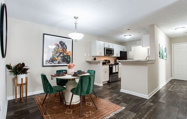 an open kitchen and dining area with a table and chairs