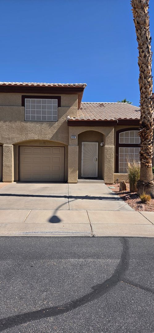 Two story 2 bedroom townhome with newer flooring, paint & appliances - community pool!