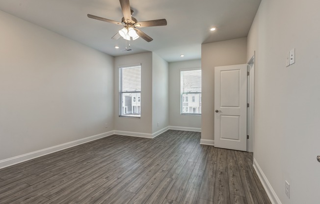 Step into luxury with this exquisite townhome featuring seamless wood plank-style flooring throughout.