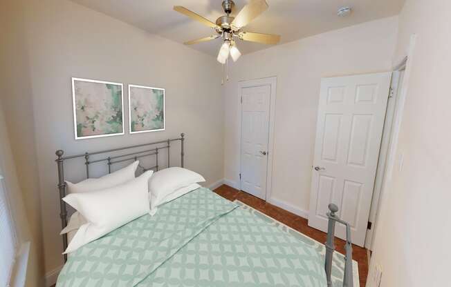 bedroom with bed, hardwood flooring and ceiling fan at parkside apartments in washington dc