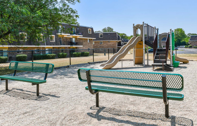 A complete playground with a slide, swings, activities for kids at Aspen Ridge Apartments in West Chicago Illinois 60185