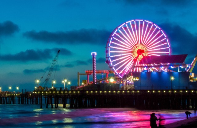 Santa Monica Pier at Night with Lit Up Pink Colored Carousel