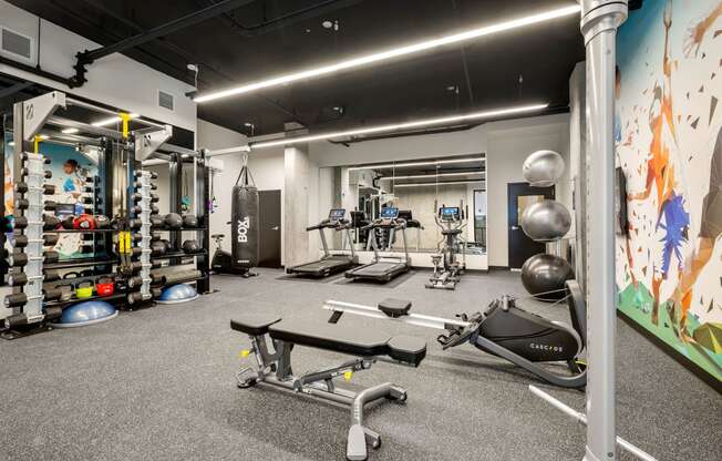 a large fitness room with weights and other exercise equipment at Ion Town Center, Washington