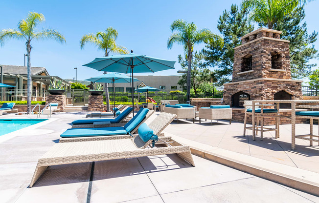 Outdoor pool area with lounge chairs