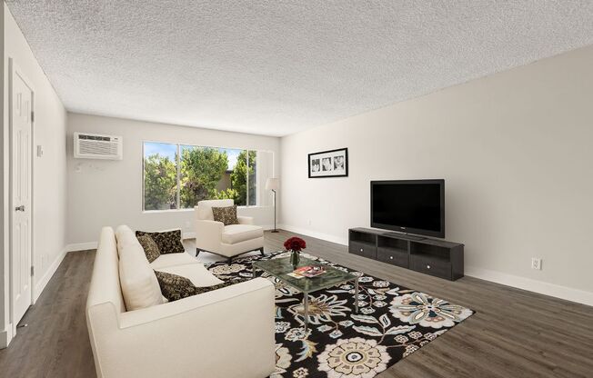 a living room with a couch and a tv