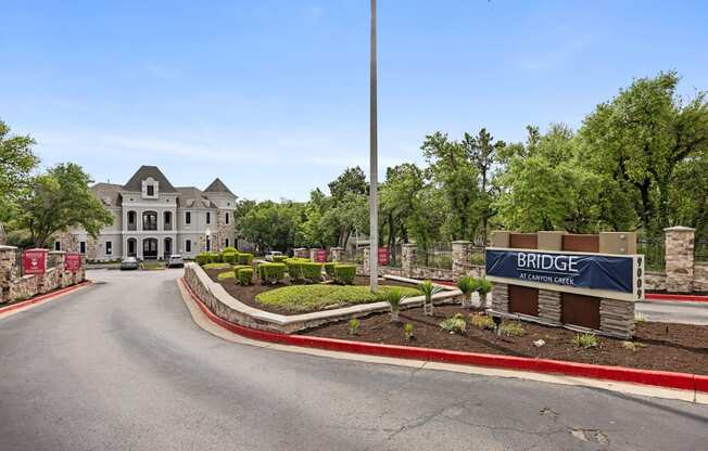 A large house with a driveway leading to the front door.