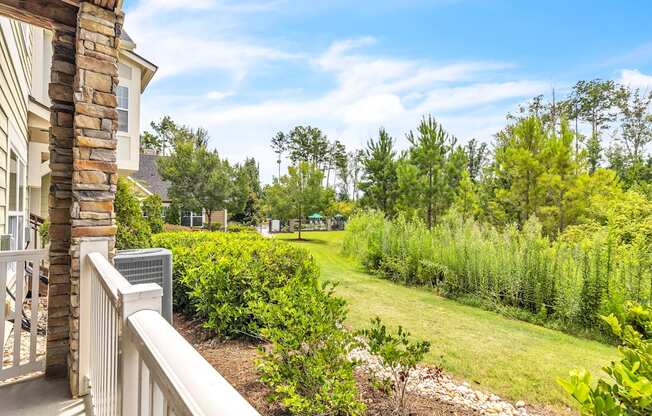 Balcony view a lush green yard at Sterling Creek at Richmond Hill, Richmond Hill, 31324