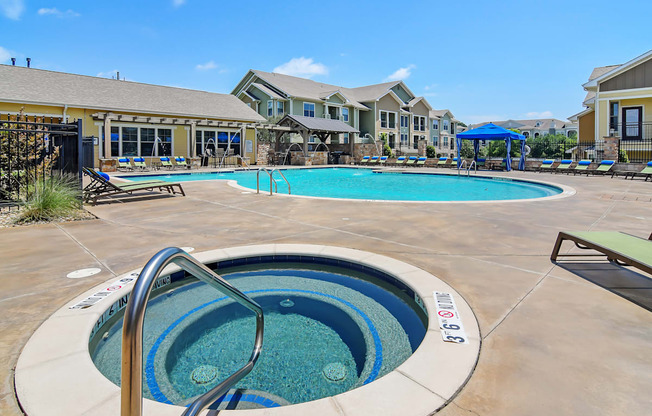 our resort style swimming pool is next to our building with our apartments in the background