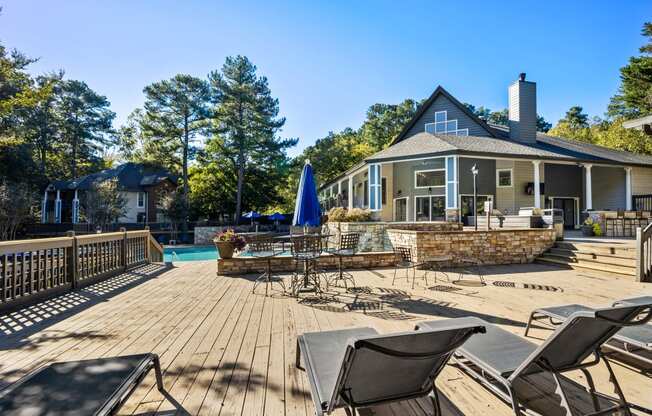 Large deck with chairs and a pool at University Ridge Apartments, Durham, NC, 27707