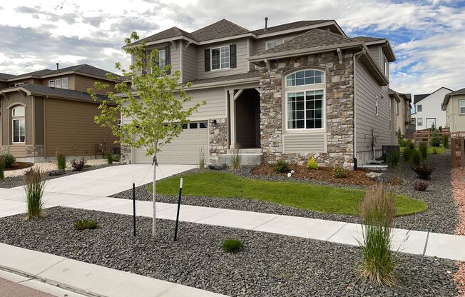 Built in 2021- Stunning 5 Bedroom 4 bath Home Nestled in Highline At Wolf Ranch