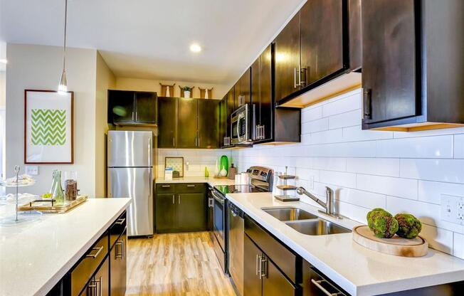 a kitchen with a sink and a refrigerator