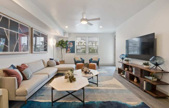 a living room with couches and a tv