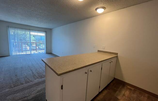 a kitchen and living room in an apartment