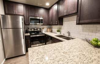 kitchen with granite counter tops and stainless appliances