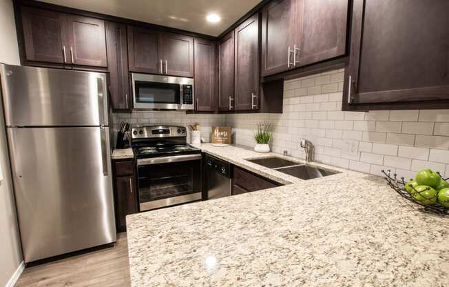 kitchen with granite counter tops and stainless appliances