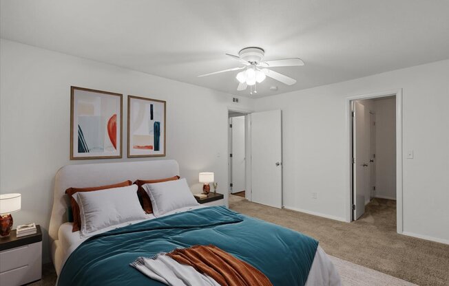 a bedroom with a bed and a ceiling fanat Millcreek Woods Apartments, Kansas, 66061