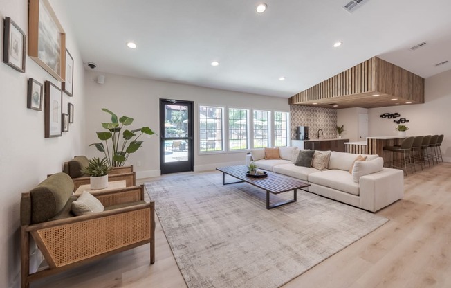 a living room with a white couch and a table