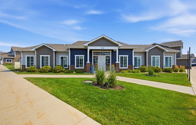 A row of houses with a blue sky above them.